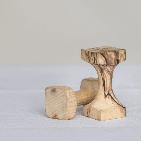 These clever wooden tools are used to help the embroiderer couch threads and beads with even tension